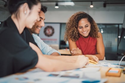 A social media manager team collaborates to find ticket giveaway ideas.